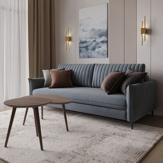 Small blue Bellucci sofa, ideal for a small living room.